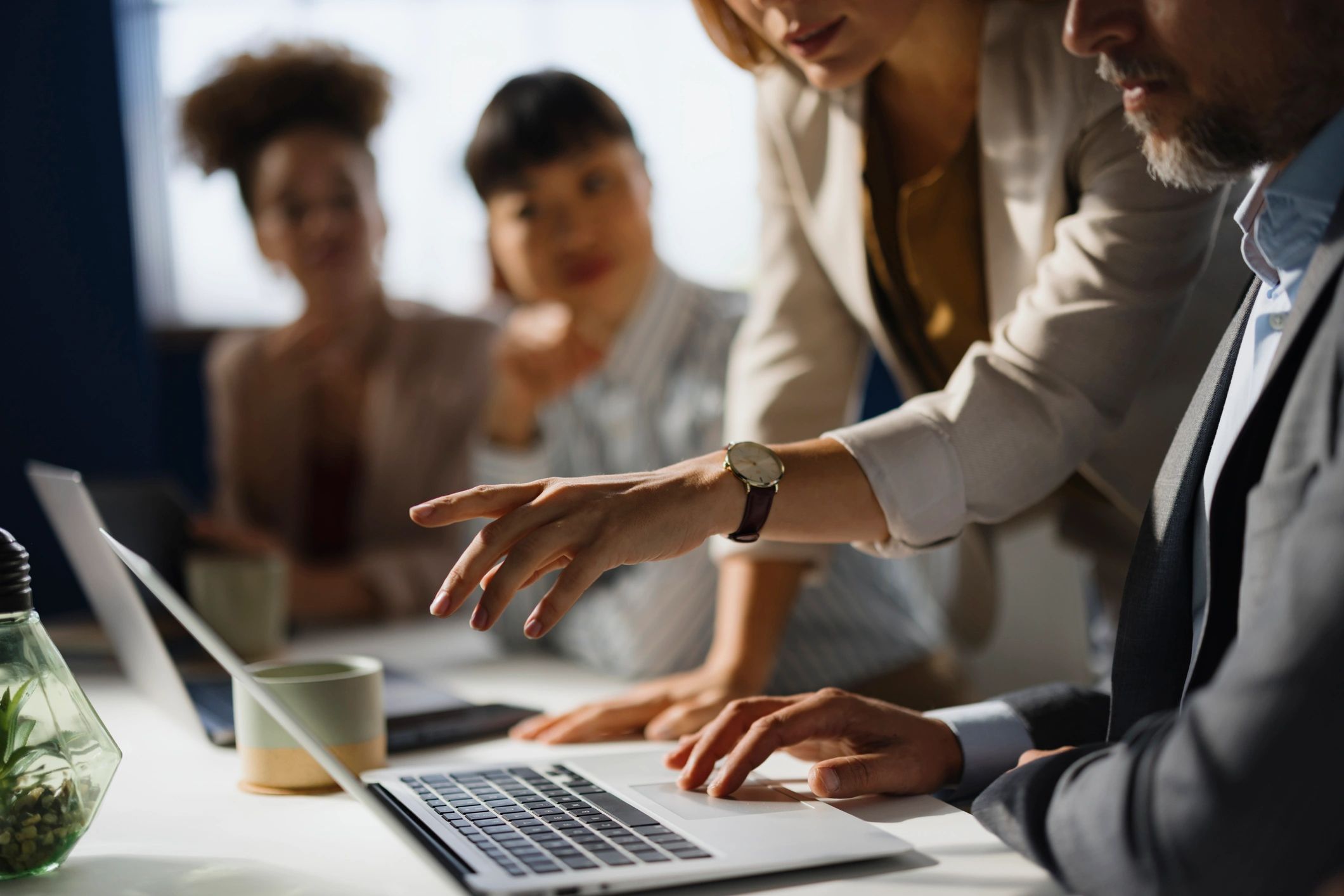Marketing professionals reviewing paid search performance on a computer