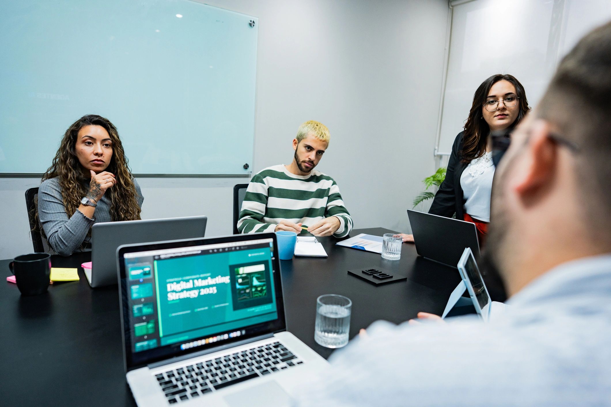 LeadZen marketing team collaborating in a modern office