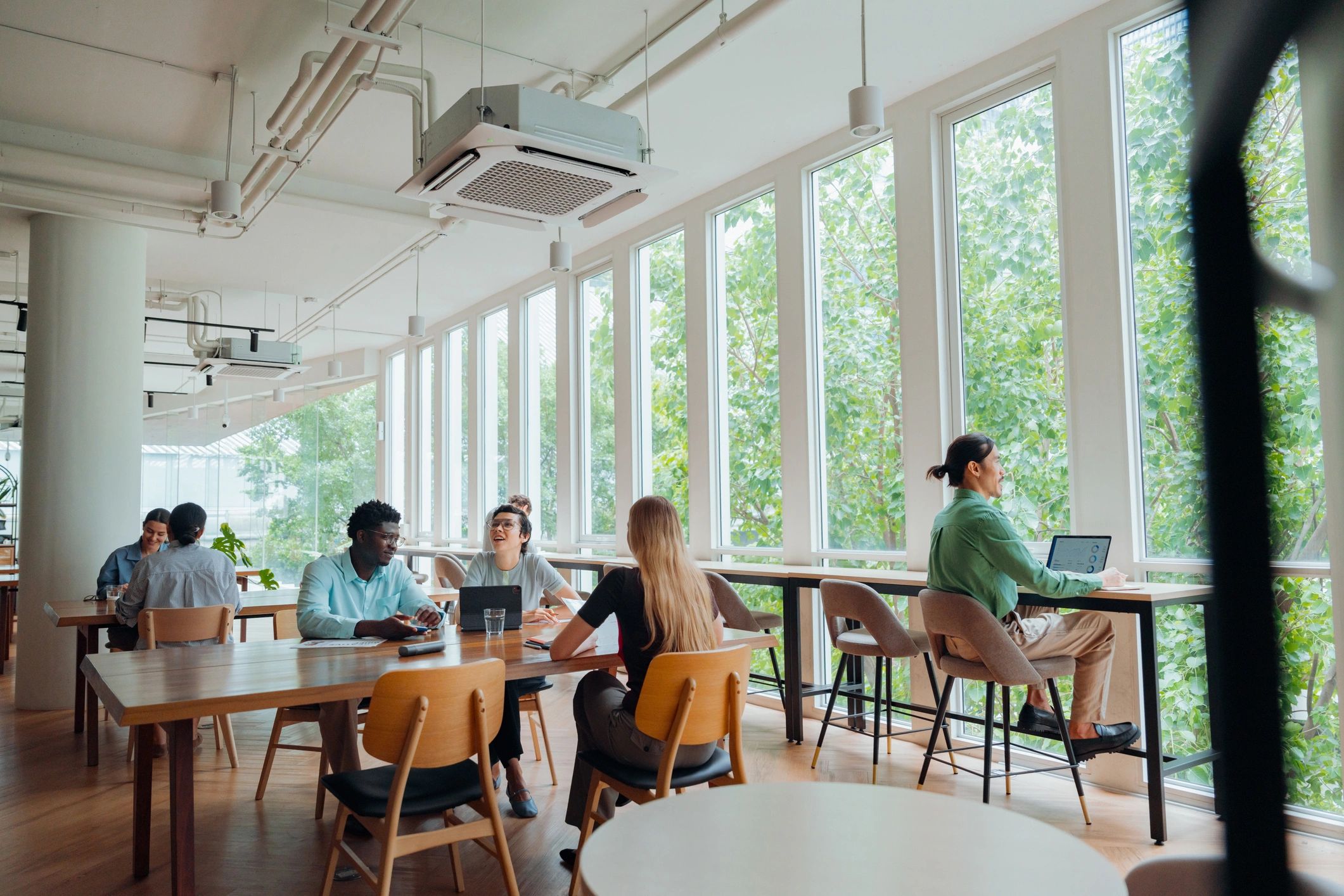 Professionals collaborating in a bright modern workspace